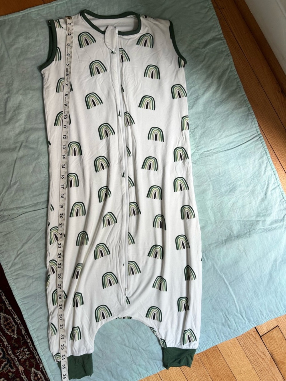 New Kyte BABY White Sleepsuit with Dark Green Trim and Rainbow Print
